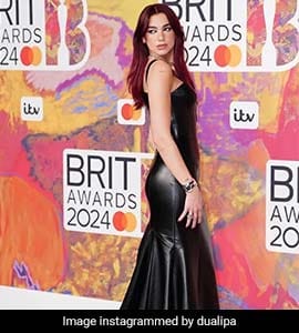 Dua Lipa Makes A Bewitching Entry In A Versace Dress For Brits Awards